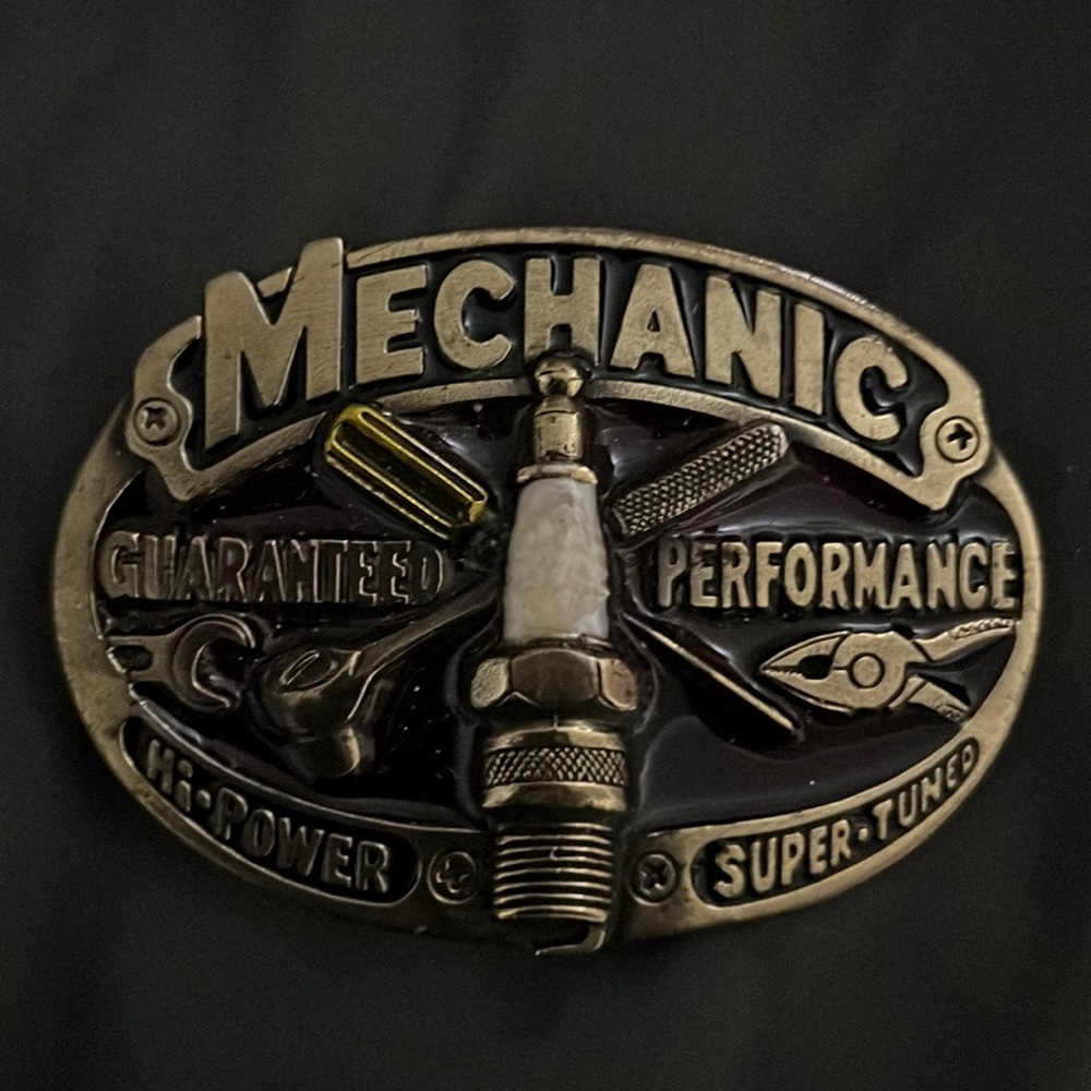 1982 mechanic men’s belt buckle.